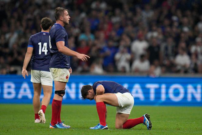 France's Anthonhy Jelonch checks on teammate Antoine Dupont after he was injured in a collision during the Rugby World Cup Pool A match between France and Namibia at the Stade de Marseille in Marseille, France, Thursday, Sept. 21, 2023.