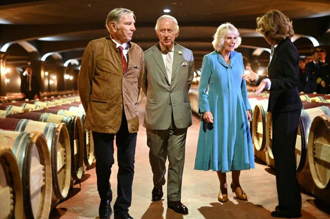 King Charles III and his wife Queen Camilla are shown around Chateau Smith Haut Lafitte by owners Daniel Cathiard (left) and Florence Cathiard (right) to learn about sustainable vineyard practices in the Bordeaux wine-producing region on the third day of their visit to France, in Martillac, southwestern France, on September 22, 2023.