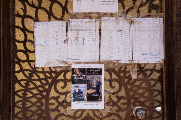 Lists of missing persons on the door of the school converted into a reception center for homeless migrant workers. Derna, Libya, September 22, 2023.