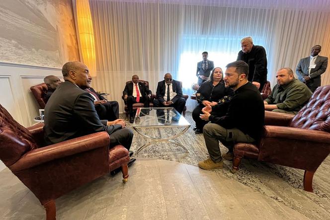 In this handout photograph taken and released by Ukrainian Presidential Press Service, Ukraine's President Volodymyr Zelensky (right) and Chairman of Sudan's Transitional Sovereignty Council Abdel Fattah al-Burhan (left) meet at Shannon Airport, Ireland, on September 23, 2023.