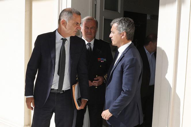 French Interior Minister Gerald Darmanin (R) talks to President of the executive council Gilles Simeoni (L) and Corsican Prefect Amaury de Saint Quentin (C) at Ajaccio prefecture during a visit on the French Mediterranean island of Corsica on September 14, 2023. 