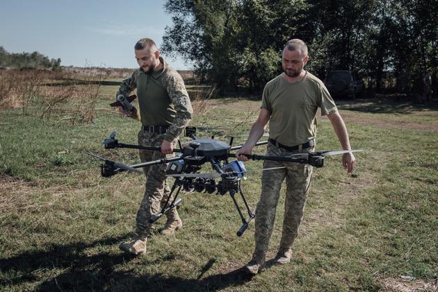 Soldiers from the 102nd brigade prepare to launch an attack drone during a training exercise, on the Zaporizhia front in Ukraine on September 20, 2023.