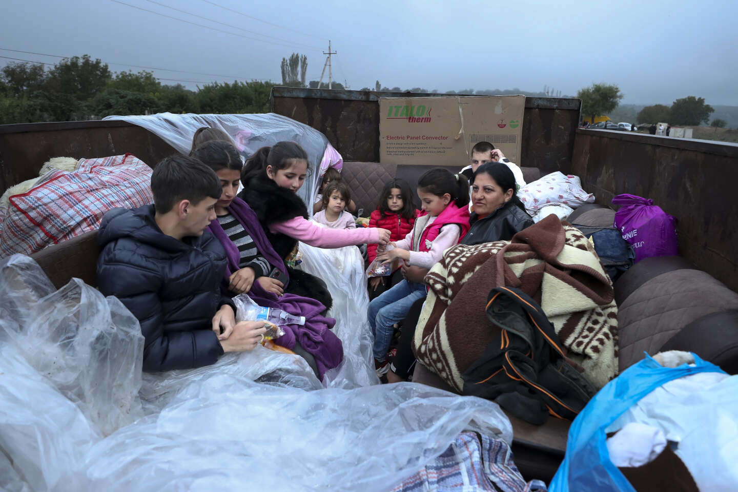 Despite Azerbaijan’s pledge to ‘guarantee’ the rights of those who remain, thousands of residents flee to Armenia.