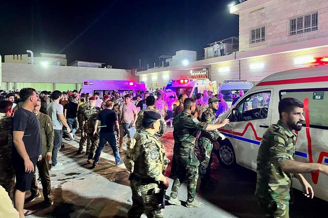 Soldiers and rescue workers surround ambulances carrying wounded people to Hamdania Hospital in Baghdad, Iraq on September 27, 2023.