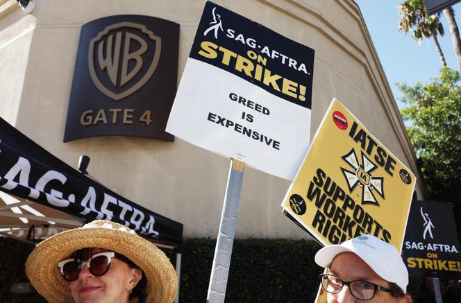 Striking SAG-AFTRA members picket outside Warner Bros. Studio as the actors strike continues on September 26, 2023 in Burbank, California.