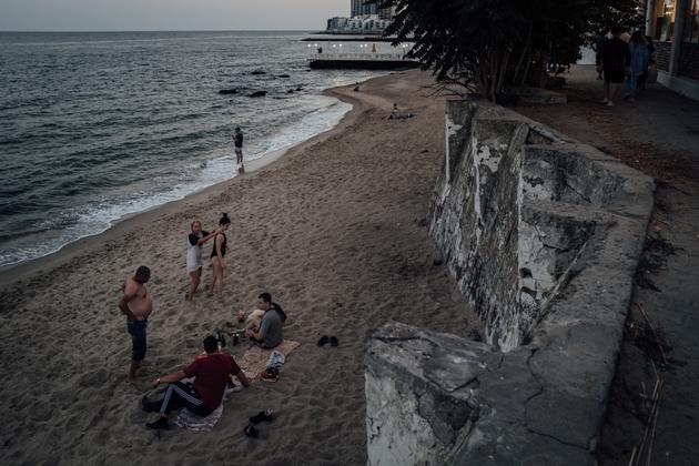 Young Ukrainians gather at the end of the day on a beach in Odesa (Ukraine), September 23, 2023.