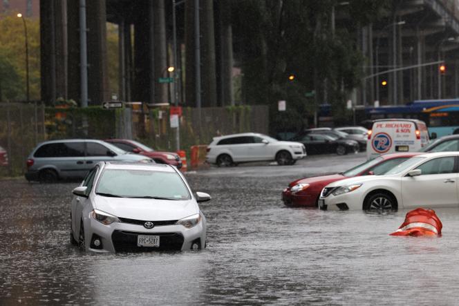 Cars are submerged in a flooded street after heavy rains as the remnants of Tropical Storm Ophelia bring flooding across the mid-Atlantic and Northeast, in New York City, US, September 29, 2023.