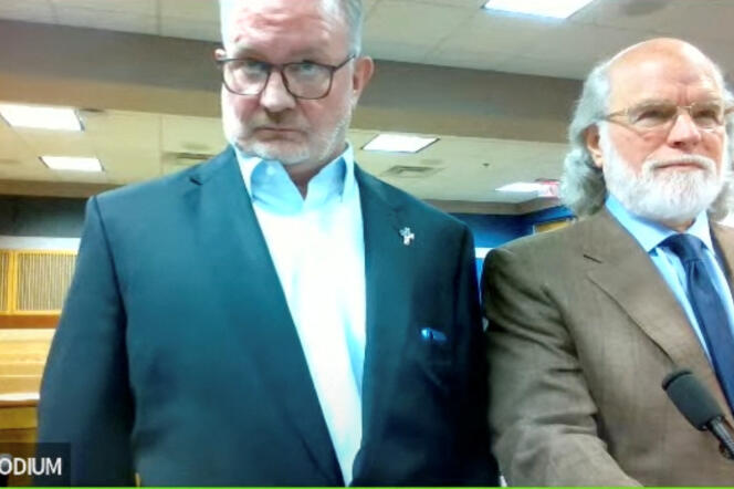 Scott Hall leaves with his attorney in a courtroom in Fulton, Georgia on September 29, 2023 (screenshot image taken during a video conference).