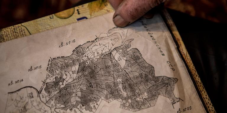 On March 12, 2021 at his home in Shurnukh Stepan Movsisyan, a former forest ranger, shows an old soviet map that show the entire village of Shurnukh falling in Armenian territory. A section of Movsisyan's home now falls under Azerbaijan's control after the war at the end of last year shifted the boundaries between Armenia and Azerbaijan.