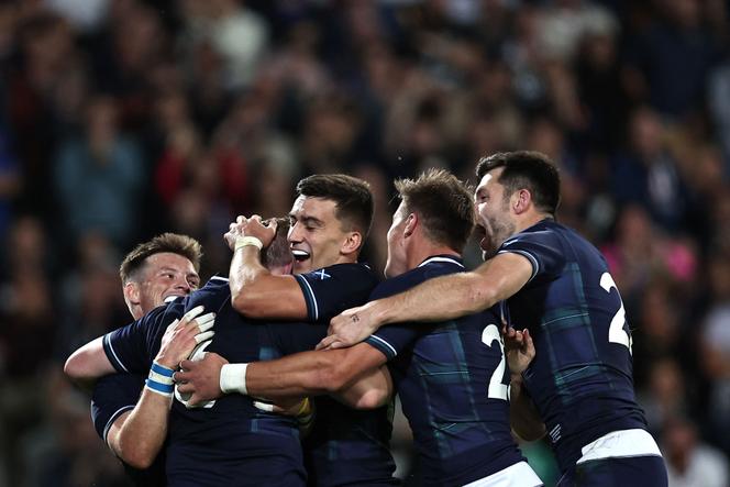Scotland's hooker Johnny Matthews (2nd L) celebrates with teammates after scoring a try during the France 2023 Rugby World Cup Pool B match between Scotland and Romania at Pierre-Mauroy stadium in Villeneuve-d'Ascq near Lille, northern France, on September 30, 2023.