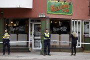 Police officers outside a pub in Sandviken, where a shooting left two people dead and two wounded, on September 22.