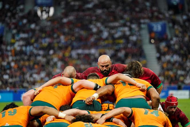 Portugal's hooker Mike Tadjer (C) prepares for a scrum during the France 2023 Rugby World Cup Pool C match between Australia and Portugal at Stade Geoffroy-Guichard in Saint-Etienne, south-eastern France, on October 1, 2023.