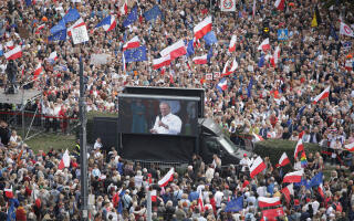 Polish opposition leader Donald Tusk appears on a video screen as his supporters attend the "March of a Million Hearts" rally, organised by the Civic Coalition opposition parties, two weeks ahead of the parliamentary election, in Warsaw, Poland October 1, 2023. Agencja Wyborcza.pl/Maciek Jazwiecki via REUTERS ATTENTION EDITORS - THIS IMAGE WAS PROVIDED BY A THIRD PARTY. POLAND OUT. NO COMMERCIAL OR EDITORIAL SALES IN POLAND.