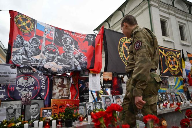 People visit a makeshift memorial for Yevgeny Prigozhin on October 1 to mark 40 days since his death, as per Orthodox tradition