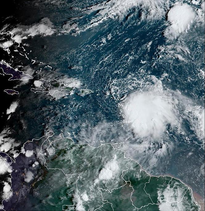 This satellite image provided by the National Oceanic and Atmospheric Administration on October 2, 2023, shows Tropical Storm Philippe, center right. 