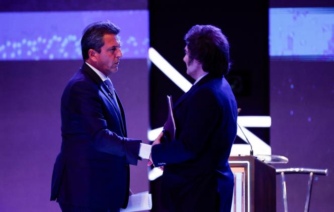 Argentina Presidential candidate Sergio Massa of Union por la Patria party and Javier Milei of La Libertad Avanza party interact during the presidential debate ahead of the October 22 general elections, at the National University of Santiago del Estero, in Santiago del Estero, Argentina October 1, 2023.