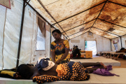 A woman with her cholera-stricken son in a temporary center at Bwaila District Hospital in Lilongwe, Malawi, on February 21, 2023.