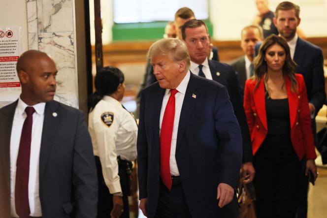 Former President Donald Trump leaves the courtroom for a recess during the second day of his civil fraud trial at New York State Supreme Court on October 3, 2023 in New York City.