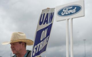 (FILES) Members of the United Auto Workers (UAW) pickett outside of the Michigan Parts Assembly Plant in Wayne, Michigan, on September 26, 2023. Ford and General Motors said around 500 more workers have been temporarily laid off due to "knock-on effects" from the ongoing strike at Detroit's "Big Three" automakers. The two companies sent home the employees who were left without work following United Auto Workers strikes on assembly plants, Ford and GM said on October 3, 2023. The UAW launched a targeted strike on September 15 on GM, Ford and Stellantis, calling stoppages at a handful of plants, while leaving most of the union's 146,000 US hourly auto workers on the job. (Photo by Matthew Hatcher / AFP)