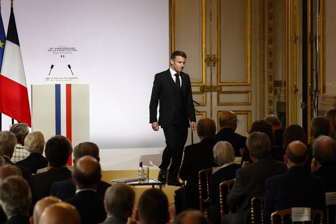 France's President Emmanuel Macron steps off the stage after his speech during a ceremony to mark the 65th anniversary of the 1958 French Constitution at the Conseil Constitutionnel (Constitutional Council) in Paris on October 4, 2023.