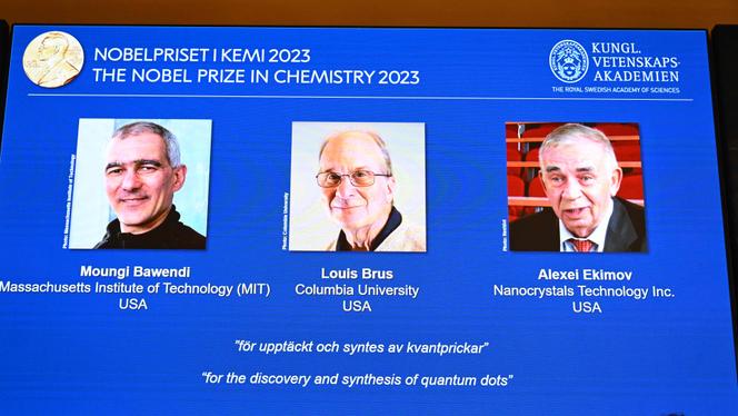 A screen shows this year's laureates US Chemist Moungi Bawendi, US Chemist Louis Brus and Russian physicist Alexei Ekimov during the announcement of the winners of the 2023 Nobel Prize in chemistry at Royal Swedish Academy of Sciences in Stockholm on October 4, 2023.
