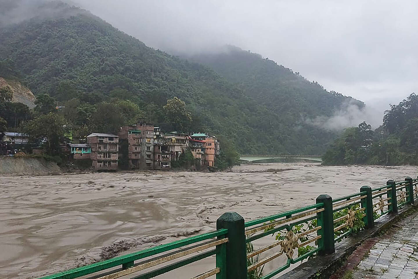 At least 10 people have been killed and 102 others missing following flash floods in the Himalayas