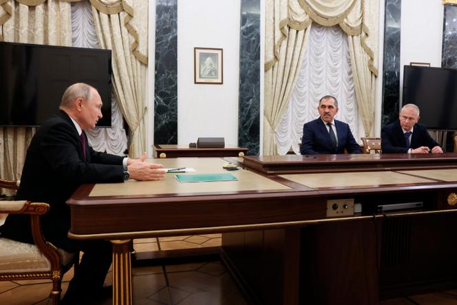 Russian President Vladimir Putin meets his Deputy Defense Minister Yunus-bek Yevkurov and retired colonel Andrei Trochev (left to right) in Moscow on September 28, 2023.