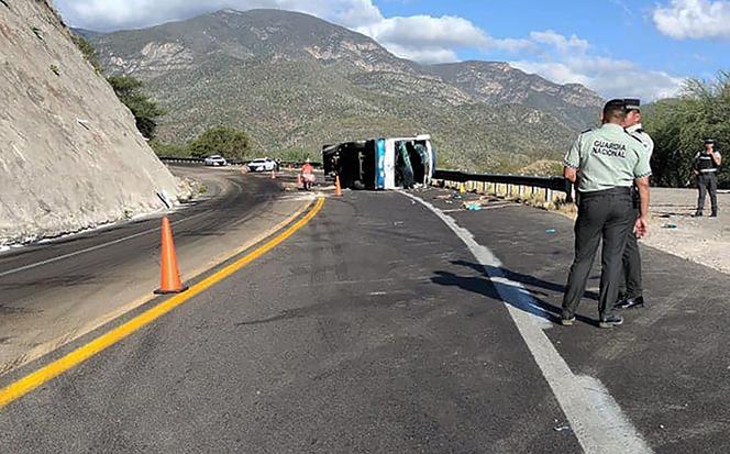 Picture released by Mexico's Civil Protection taken at the site of a bus accident in which at least 18 migrants were killed, in Cuacnopalan, Oaxaca State, Mexico, on October 6, 2023. 