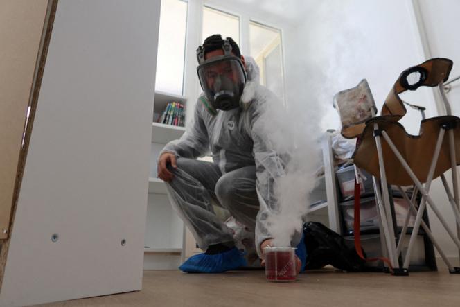 Sacha Krief, manager of Hygiene Premium pest control specialized store and extermination service, treats an apartment against bedbugs in Paris, France, October 6, 2023.