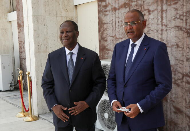 Ivorian President Alassane Otara and his Prime Minister Patrick Achey in Abidjan in April 2021.