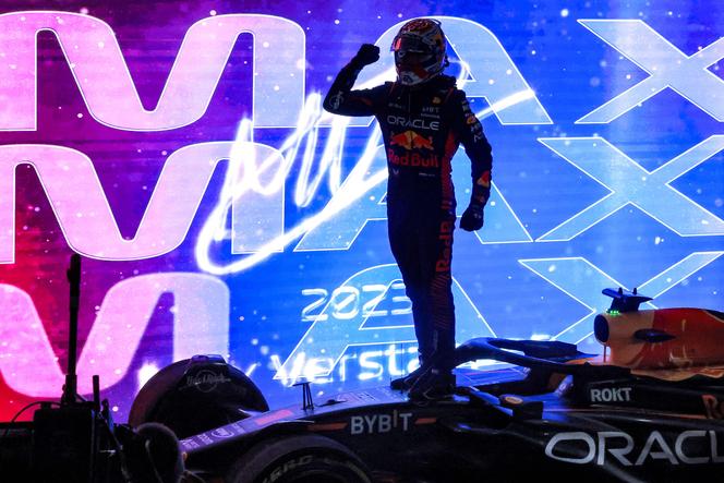 Red Bull Racing's Dutch driver Max Verstappen celebrates winning his third world title after the sprint race ahead of the Qatari Formula One Grand Prix at the Lusail International Circuit on October 7, 2023.