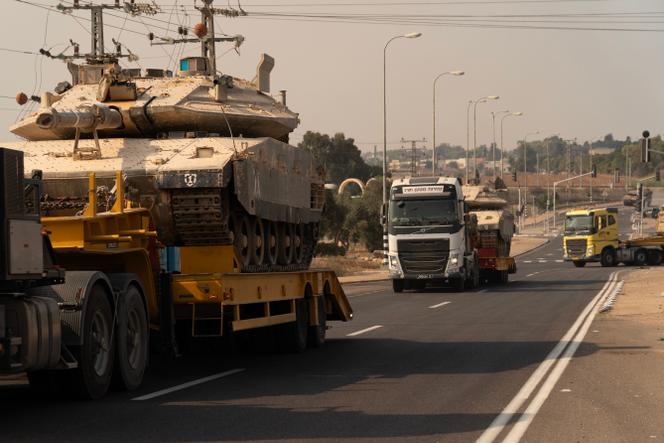 Israeli tanks being transported by highway to the Gaza border, in preparation for a ground offensive, October 8, 2023.