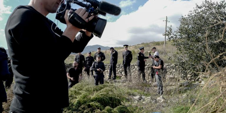 LUCAS BARIOULET FOR «LE MONDE». An Azerbaijani officer answers questions from local journalists in a field of hemp he says was taken back from Armenian forces near Agdam, in northern Nagorno-Karabakh during a tour organized by the Azerbaijani government on October 6, 2023 in Azerbaijan. LUCAS BARIOULET FOR