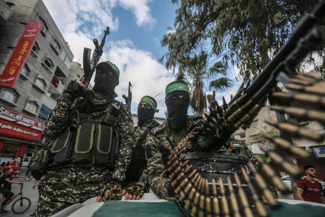 Members of the military wing of Hamas, parade, May 22, 2021, in Gaza City, after the death of its commander-in-chief Bassem Issa.