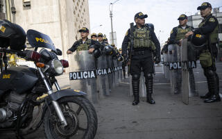 Police officers stand guard before the arrival of Peruvian President Dina Boluarte, outside the Peruvian Prosecutor's building in Lima. on September 27, 2023. The Prosecutor’s Office summoned Peruvian president Dina Boluarte over crackdown on recent protests that left 50 people dead. (Photo by ERNESTO BENAVIDES / AFP)