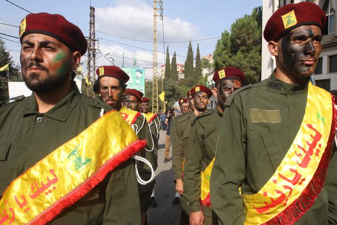 Hezbollah members at the funeral of their comrades in Khirbet Silem, Lebanon, on October 10, 2023, after Israeli strikes.