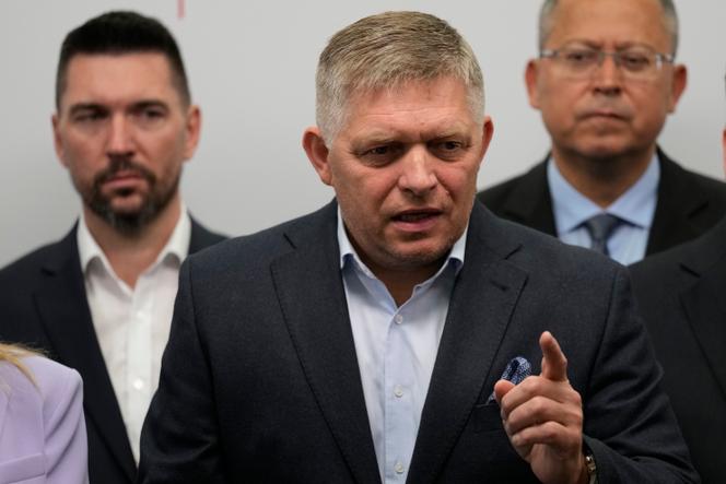 Chairman of Smer-Social Democracy party Robert Fico, center, adresses the results of an early parliamentary election during a press conference in Bratislava, Slovakia, Sunday, October 1, 2023. 