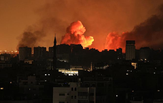 A ball of fire erupts in Gaza City after an Israeli air strike on October 12, 2023.