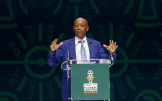 Soccer Football- Africa Cup of Nations draw.- The exhibition center of Abidjan, Ivory Coast - October 12, 2023. Patrice Motsepe, president of CAF (African Football Confederation) speaks during the draw. REUTERS/Luc Gnago