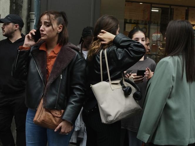 Parents wait to see their children after a stabbing at the Lycée Gambetta in the northern town of Arras.