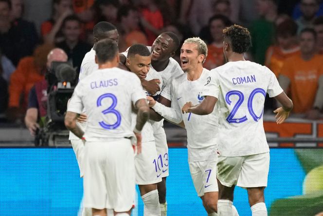 France's Kylian Mbappe, center left, celebrates after scoring his side's second goal during the Euro 2024 group B qualifying soccer match between The Netherlands and France at the Johan Cruyff ArenA stadium in Amsterdam, Netherlands, Friday, October 13, 2023.