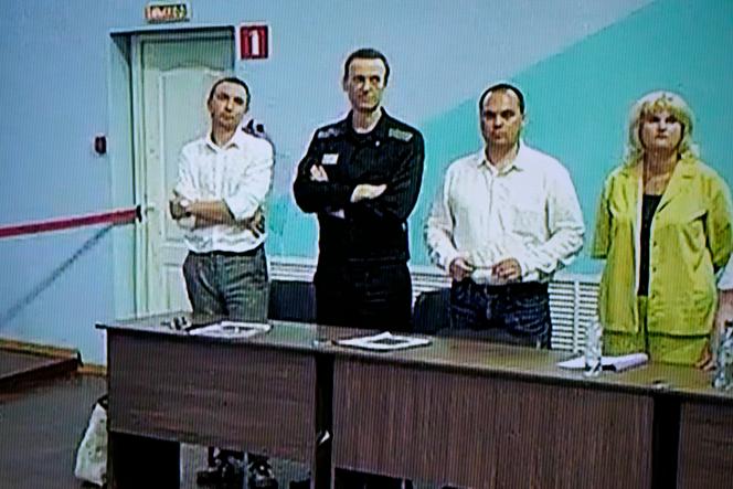 Russian opponent Alexei Navalny (second left), and his lawyers Alexander Fedulov (left), Olga Mikhailova (right) and Vadim Kobzev (second right), on a video transmitted from Melekhovo prison (Russia), August 4, 2023.