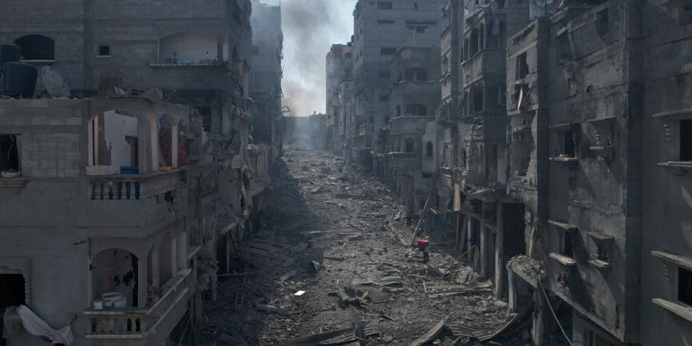 Hatem Moussa/AP Rubble litters a street between smoldering buildings hit by an Israeli airstrike in Jabaliya, Gaza Strip, Wednesday, Oct. 11, 2023. (AP Photo/Hatem Moussa)
