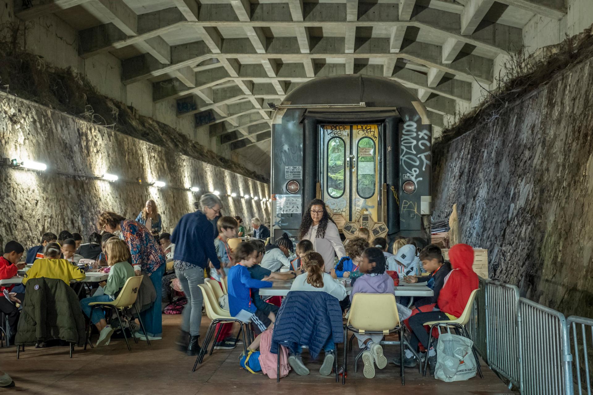 Pupils from two CM1-CM2 classes at Providence B school in the 13th arrondissement take part in a heatwave simulation exercise in Paris on October 13, 2023.