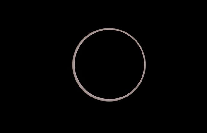 The moon crosses the sun completing its maximum eclipse during the Annular Solar Eclipse on October 14, 2023 in Capitol Reef National Park, Utah.