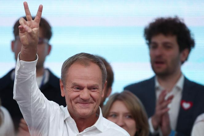 Donald Tusk, leader of the largest opposition grouping Civic Coalition (KO), gestures after the exit poll results are announced in Warsaw, on October 15, 2023.