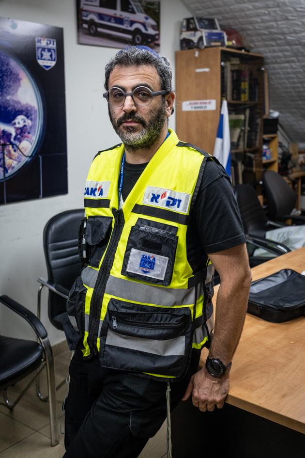 Nachman Dyksztejn, a member of the NGO ZAKA, poses in the organization's offices in Jerusalem on October 16, 2023.