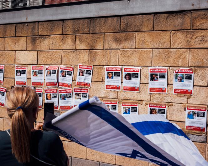 A wall covered with posters representing each Hamas hostage, in front of the Israeli army headquarters in Tel Aviv on October 14, 2023.