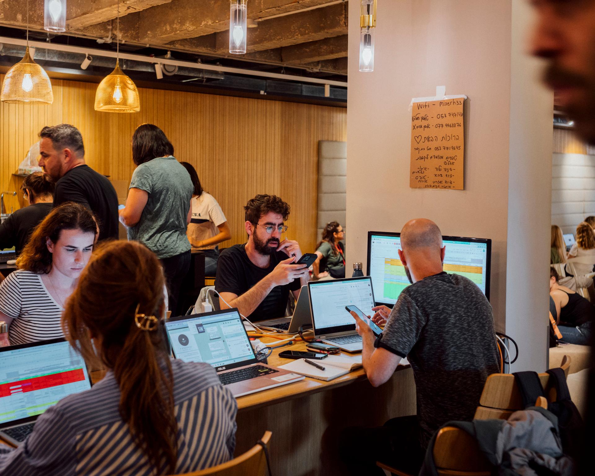 Engineers transformed a coworking space to centralize requests and needs for material distribution to Israeli military and civilians, at the Tel Aviv Exhibition Center, October 15, 2023.