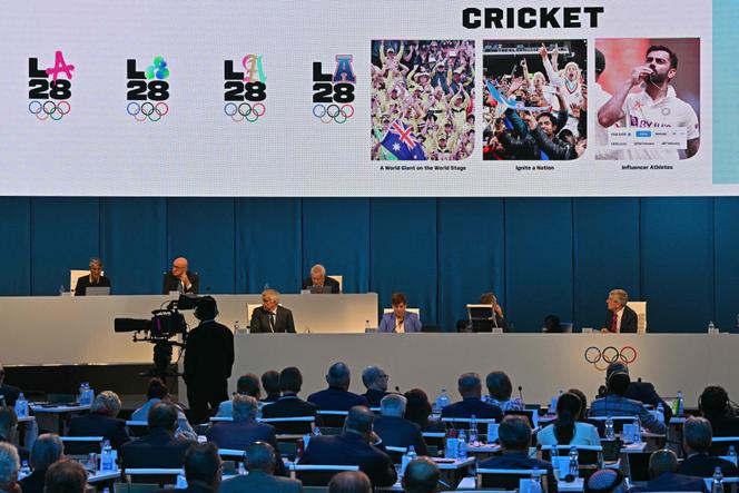 A digital display shows the game of Cricket for its feature as one of five new sports at the 2028 Olympic Games in Los Angeles, during the second day of the 141st International Olympic Committee (IOC) session in Mumbai on October 16, 2023.